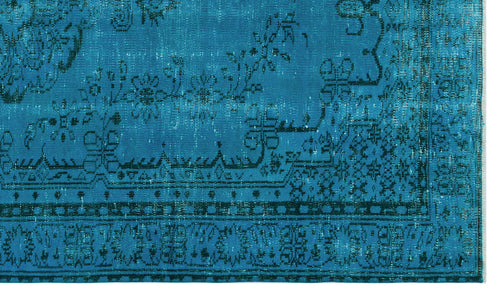 Load image 1 in gallery view. Bright turquoise rug with a distressed black floral and geometric border pattern.