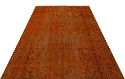 Load image 1 in gallery view. Burnt orange vintage-style rug with a faded dark brown traditional medallion and border pattern on a white background.