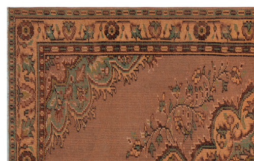 Load image 1 in gallery view. Rust-colored traditional rug with a green and brown floral border and intricate medallion corner detail.