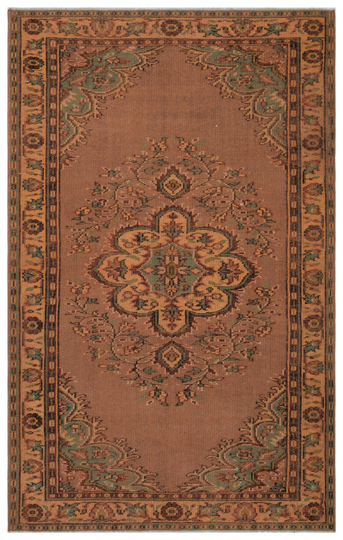 Load image 1 in gallery view. Brown traditional rug with a central floral medallion and ornate border in muted green and tan accents.