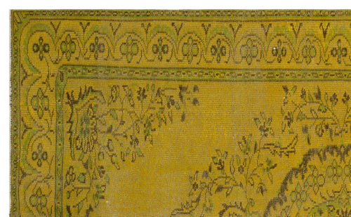 Load image 1 in gallery view. Mustard yellow and olive green vintage-style rug with a decorative floral border and central medallion pattern.