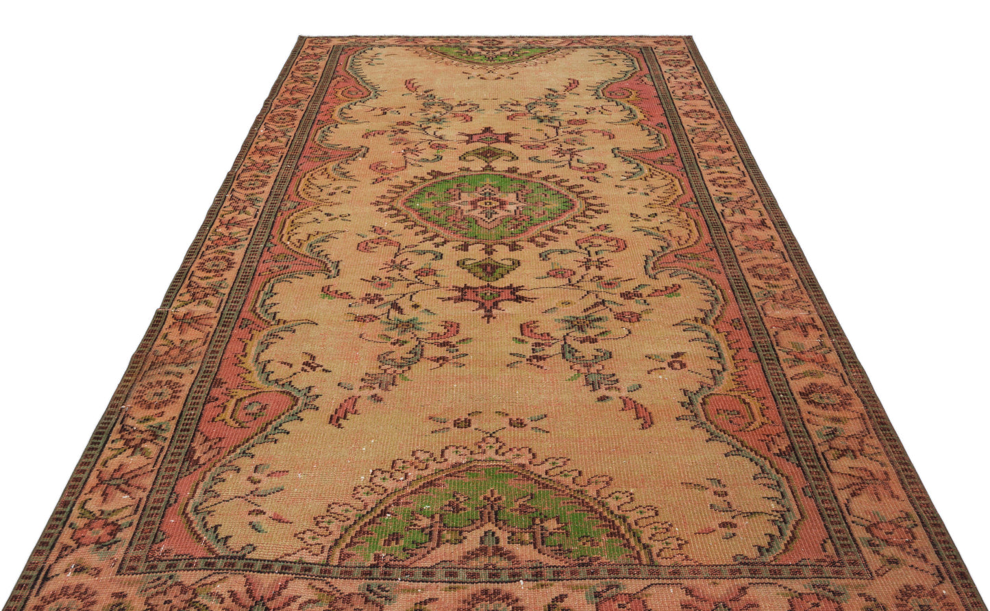 Tan vintage-style runner rug with a central green medallion, floral motifs, and a coral border on a white background.