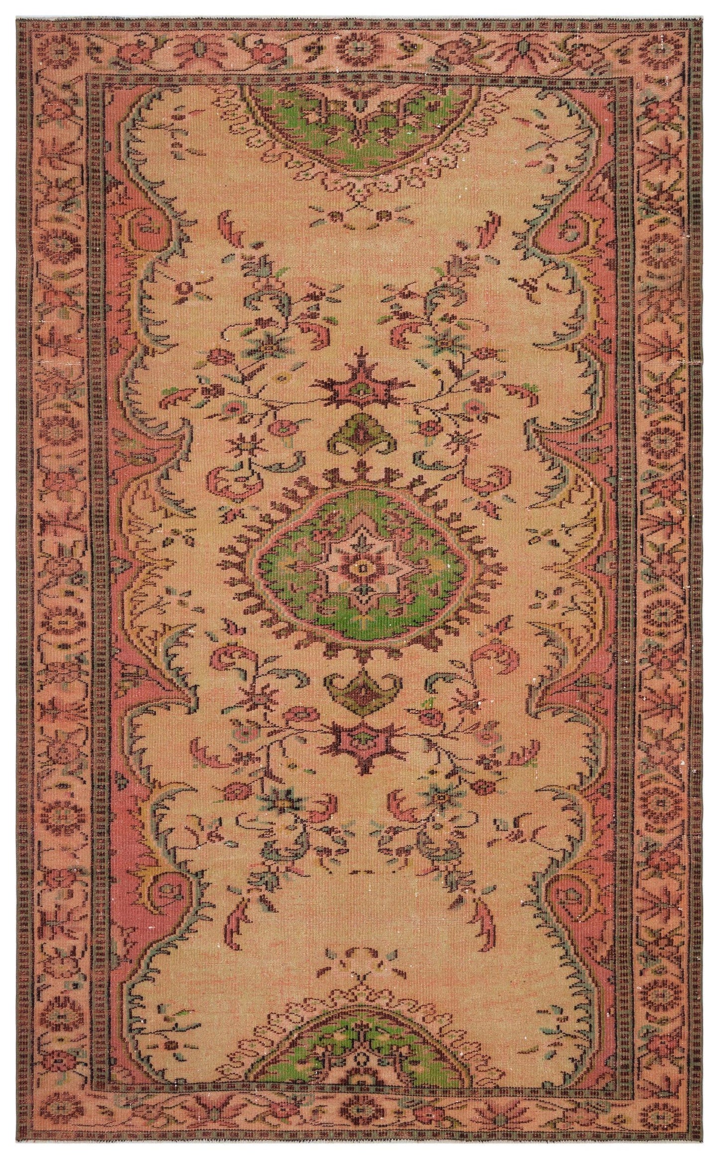 Tan vintage-style rug with a central green floral medallion, pink borders, and intricate botanical motifs.