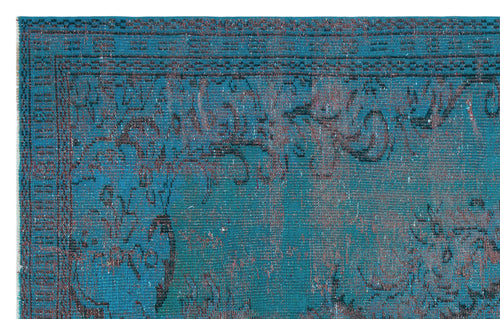 Load image 1 in gallery view. Teal and dark blue distressed rug with a faded traditional floral border and medallion pattern.
