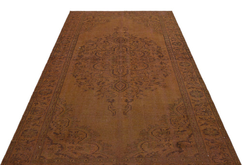 Load image 1 in gallery view. Rust-colored vintage rug with a central medallion and ornate border pattern on a white background.
