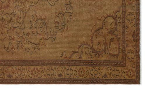 Load image 1 in gallery view. Rust and brown traditional rug with a faded floral medallion pattern and a geometric border.