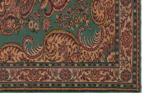 Load image 1 in gallery view. Green and brown traditional rug with a detailed paisley and floral border pattern.