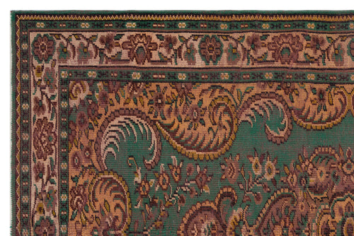 Load image 1 in gallery view. Green and brown traditional rug with a detailed floral and paisley border pattern.