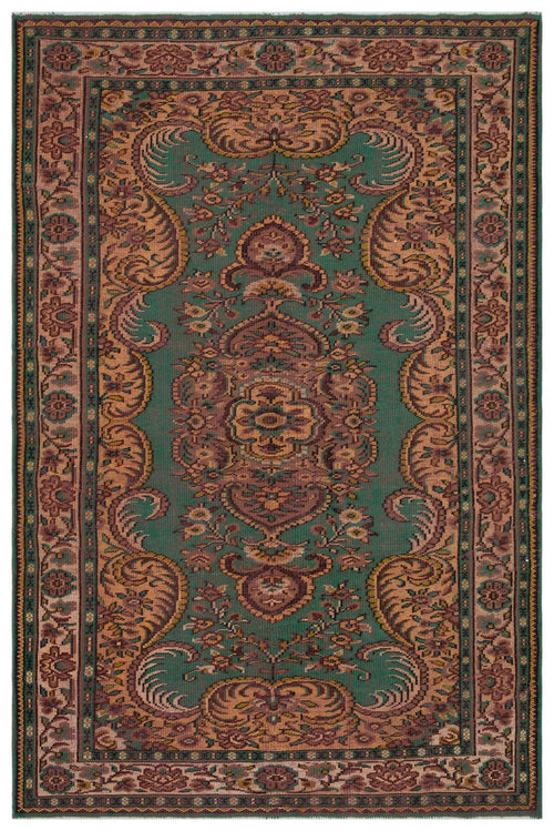 Load image 1 in gallery view. Emerald green rug with a central floral medallion and intricate paisley border in shades of brown, tan, and muted red.