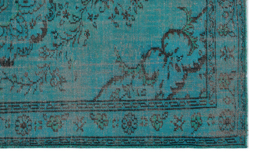 Load image 1 in gallery view. Teal and black distressed rug with a traditional floral medallion pattern and a geometric border.