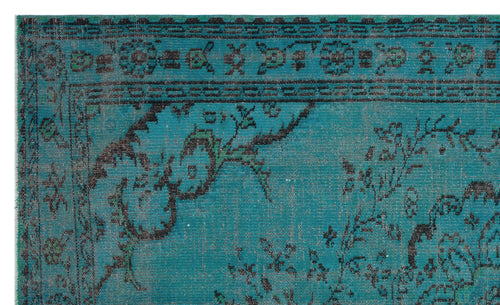 Load image 1 in gallery view. Teal rug with a distressed black floral medallion pattern and a decorative geometric border.
