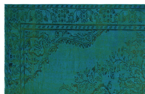 Load image 1 in gallery view. Teal and dark green traditional rug with a distressed floral medallion pattern and a decorative border.