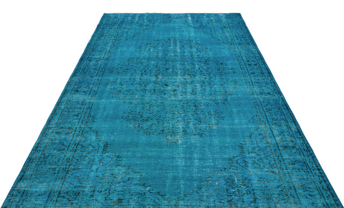 Load image 1 in gallery view. Bright turquoise distressed rug with a dark blue traditional medallion pattern on a white background.