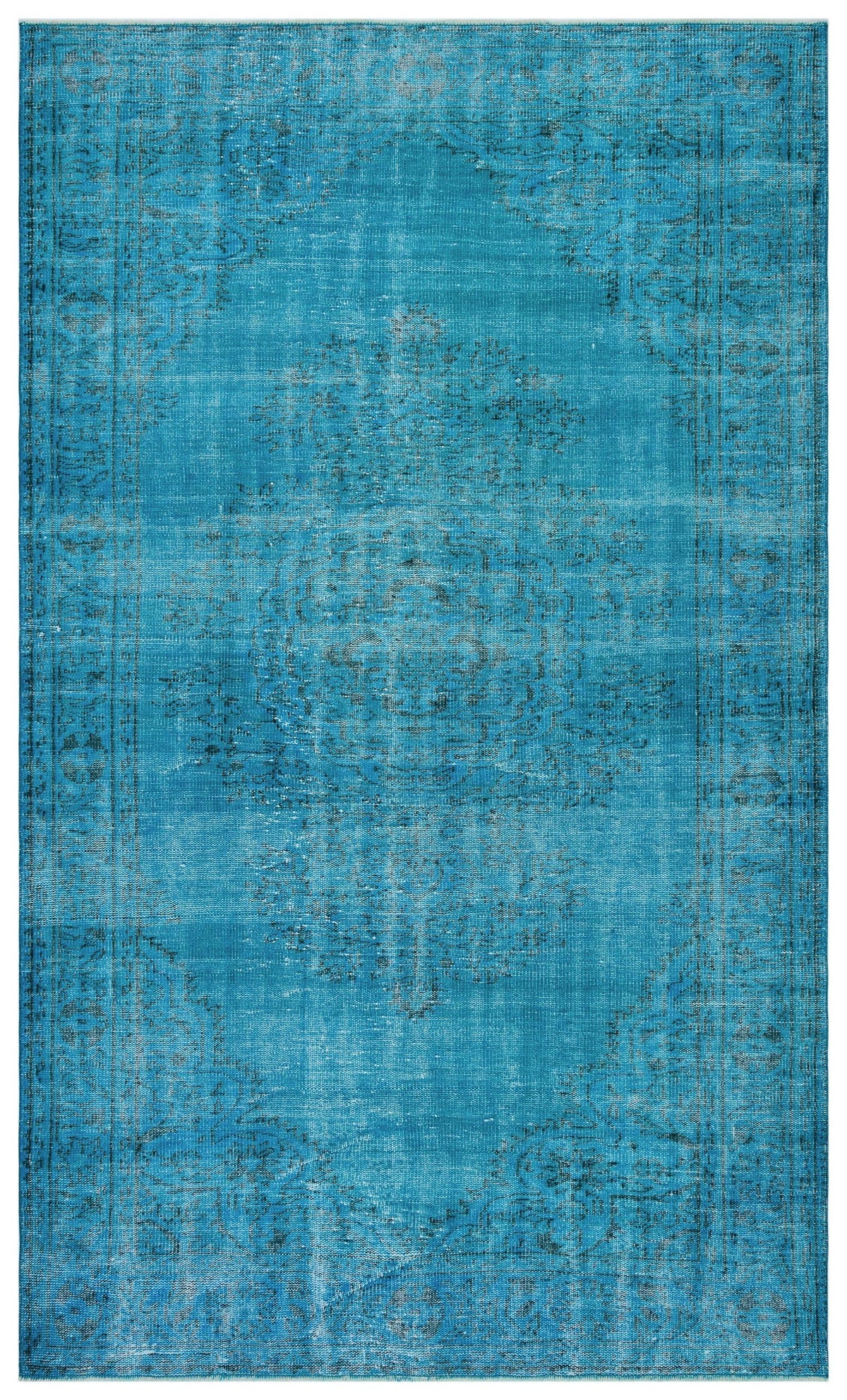 Bright turquoise distressed rug with a faded traditional medallion pattern and a decorative border.
