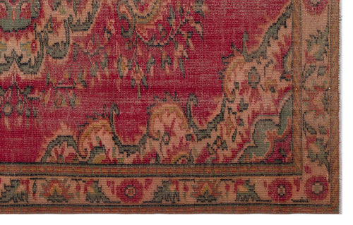 Load image 1 in gallery view. Red and muted green traditional rug with a distressed floral medallion pattern and a detailed geometric border.