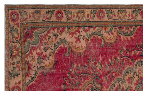 Load image 1 in gallery view. Traditional red rug with a distressed floral border and central medallion pattern in muted green and beige tones.