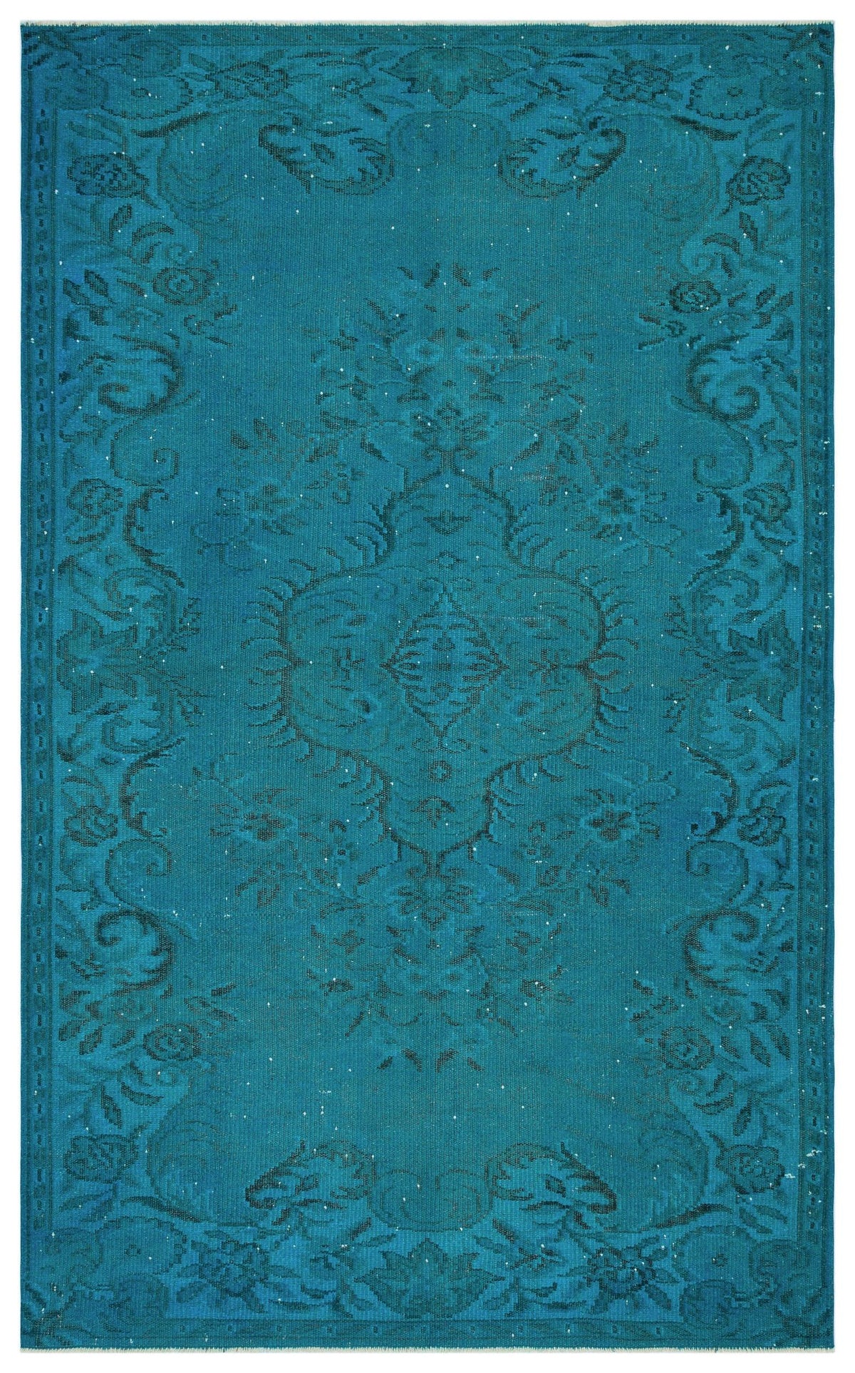 Teal area rug with a dark blue distressed floral medallion pattern and a decorative border.