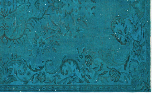 Load image 1 in gallery view. Teal rug with a distressed, dark floral medallion pattern and a bordered edge.