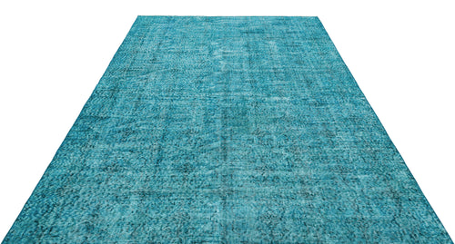 Load image 1 in gallery view. Teal rectangular rug with a distressed, faded traditional medallion pattern on a white background.