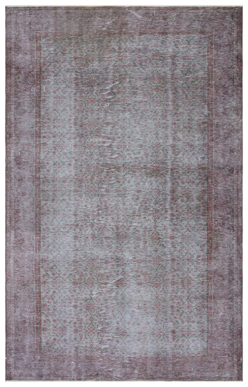 Load image 1 in gallery view. Muted mauve and grey distressed rug with a faded floral medallion pattern and a wide border.