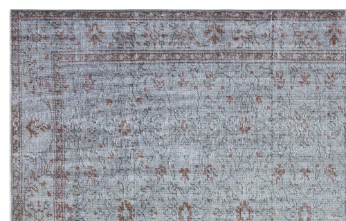 Load image 1 in gallery view. Grey and terracotta distressed rug with a traditional floral medallion pattern and a decorative border.
