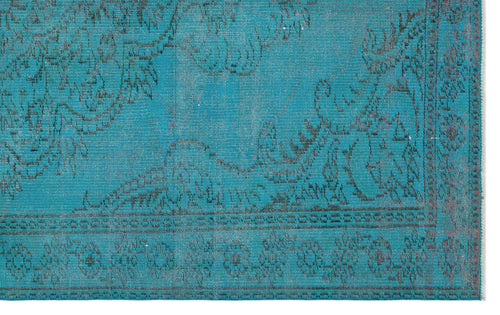 Load image 1 in gallery view. Teal distressed rug with a dark grey floral medallion pattern and a decorative border.