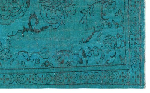 Load image 1 in gallery view. Teal rug with a black distressed floral medallion pattern and a geometric border.
