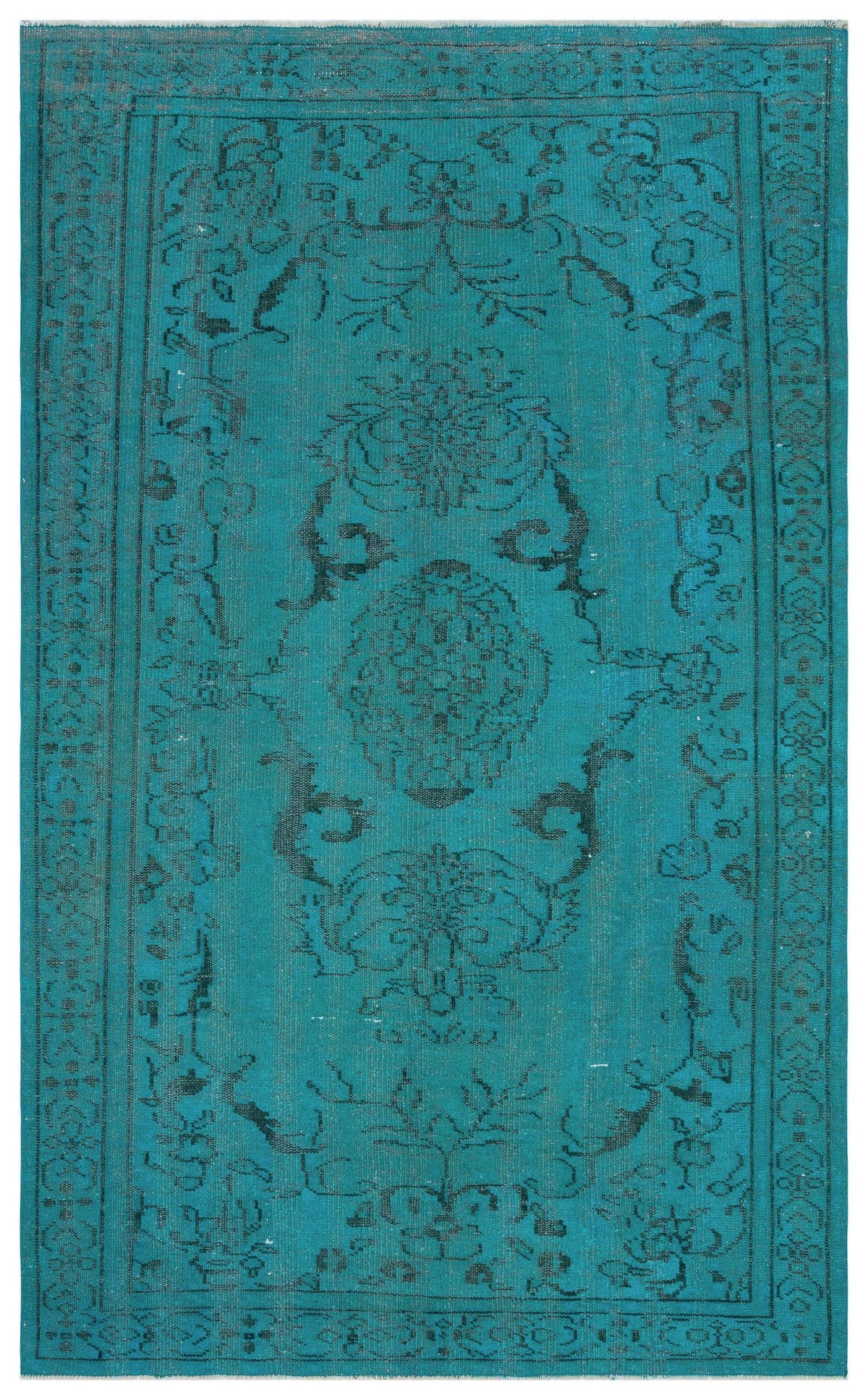 Teal rug with a distressed black floral medallion pattern and a decorative border.