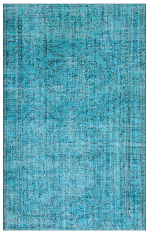 Load image 1 in gallery view. Bright turquoise distressed rug with a faded traditional floral medallion pattern and a bordered edge.