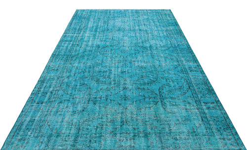 Load image 1 in gallery view. Bright turquoise area rug with a distressed, faded traditional medallion pattern on a white background.