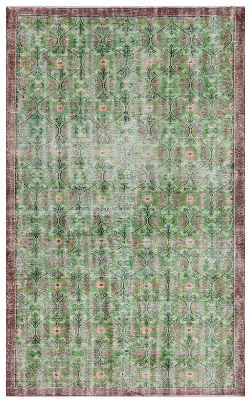 Load image 1 in gallery view. Green and brown distressed rug with a repeating geometric lattice pattern and floral motifs.