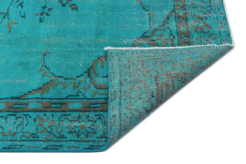 Load image 1 in gallery view. Teal and grey distressed traditional rug with a folded corner showing the underside texture.
