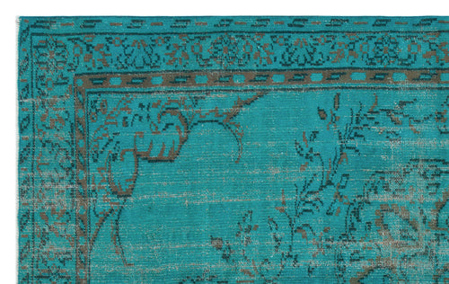 Load image 1 in gallery view. Teal rug with a distressed brown floral border and traditional medallion pattern.