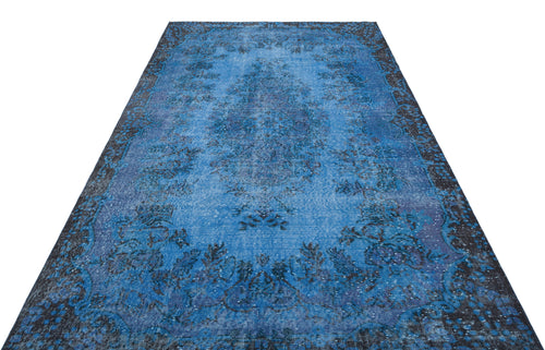 Load image 1 in gallery view. Blue and black distressed traditional rug with a central medallion and ornate border on a white background.