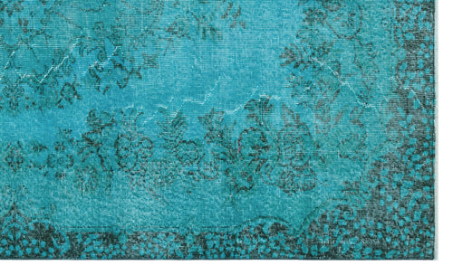 Load image 1 in gallery view. Teal rug with a distressed black floral pattern and a decorative dotted border.