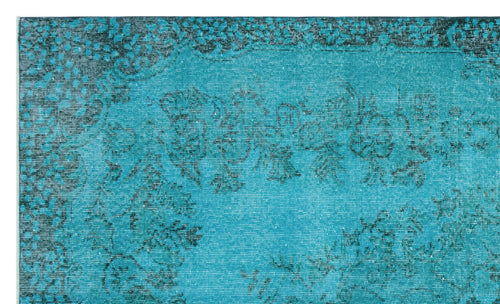 Load image 1 in gallery view. Teal rug with a distressed black floral pattern and a decorative border.