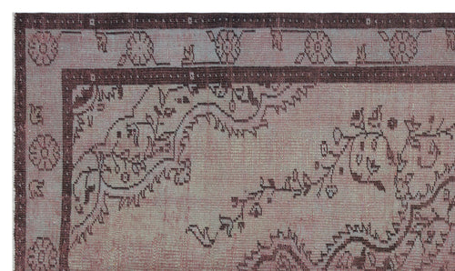 Load image 1 in gallery view. Muted mauve and dark brown rug with a distressed traditional floral border and vine pattern.
