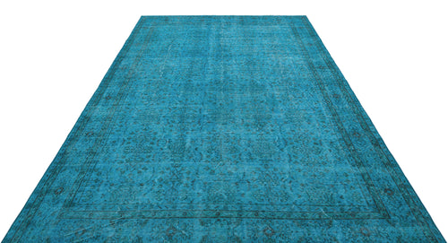 Load image 1 in gallery view. Bright turquoise distressed rug with a traditional dark floral border and central medallion pattern on white background.