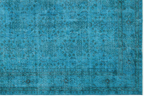 Load image 1 in gallery view. Teal distressed rug with a dark blue traditional floral medallion pattern and a bordered edge.