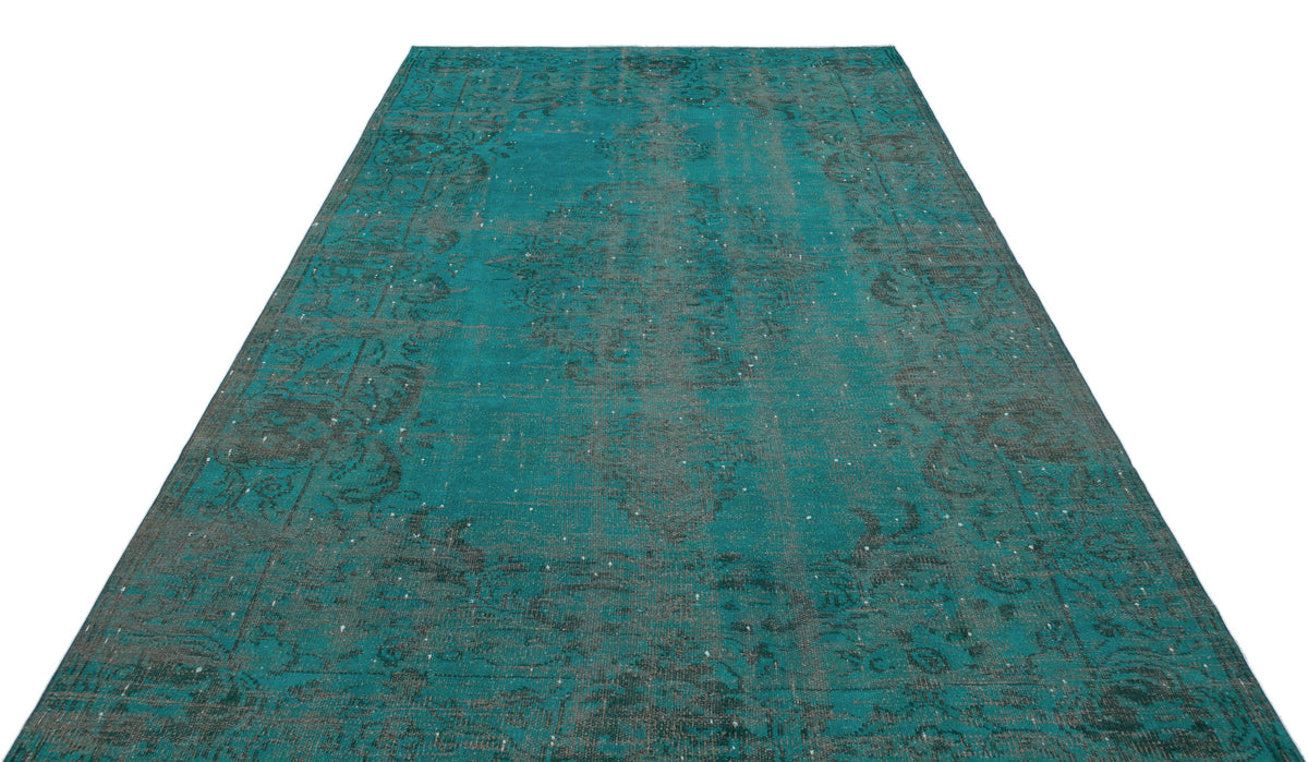 Teal and charcoal distressed vintage-style rug with a traditional central medallion pattern on a white background.