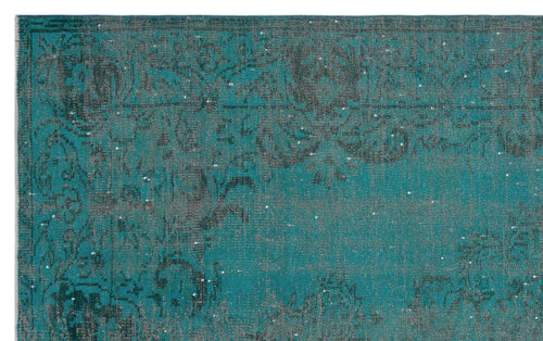 Load image 1 in gallery view. Teal and charcoal distressed rug with a faded traditional floral medallion pattern.