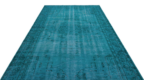 Load image 1 in gallery view. Teal distressed area rug with a faded traditional medallion pattern and ornate border on a white background.