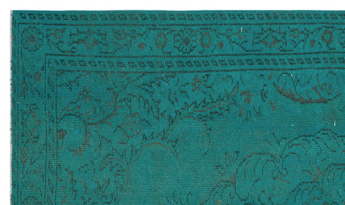Load image 1 in gallery view. Teal rug with a dark grey distressed floral medallion pattern and a decorative border.