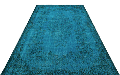 Load image 1 in gallery view. Teal distressed area rug with a traditional floral medallion pattern on a white background.