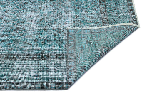 Load image 1 in gallery view. Teal and charcoal distressed vintage-style rug with a folded corner showing the woven backing on a white background.