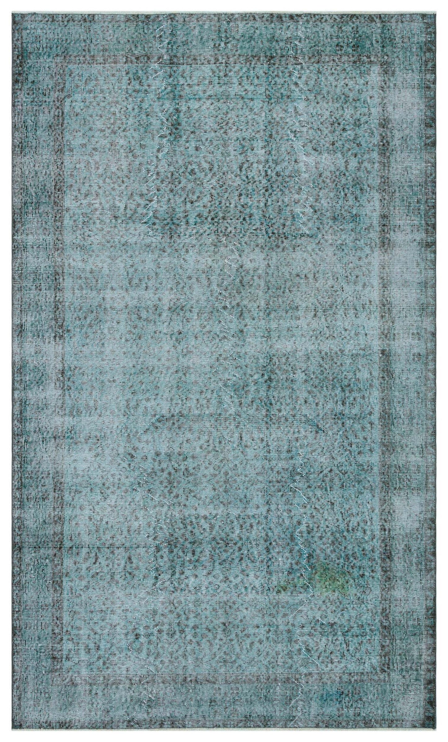 Teal and grey distressed vintage-style rug with a faded central medallion and a dark border.