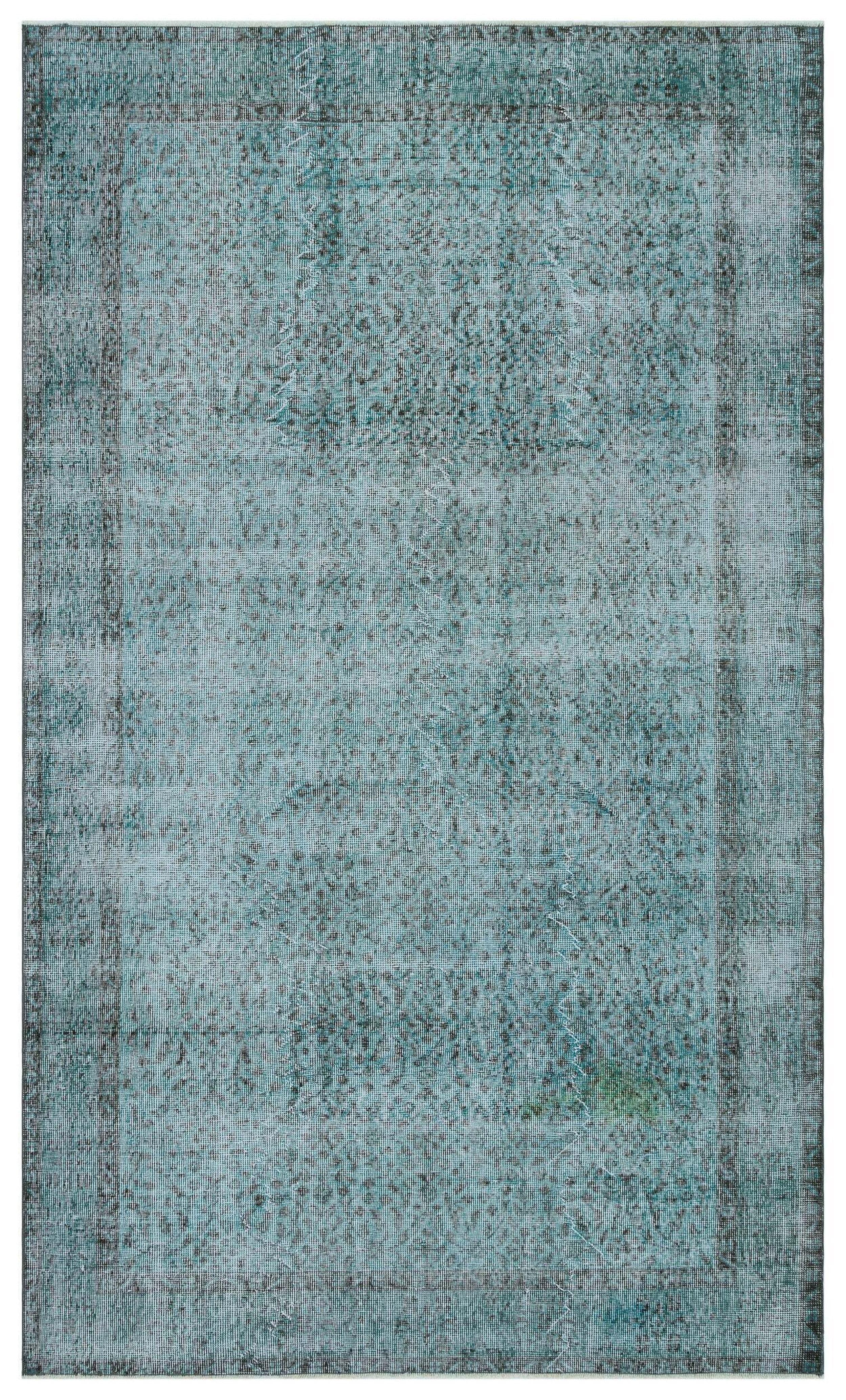 Teal and grey distressed vintage-style rug with a faded central medallion and a dark border.