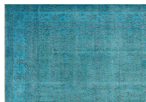 Load image 1 in gallery view. Teal monochromatic rug with a distressed traditional floral border and central medallion pattern.