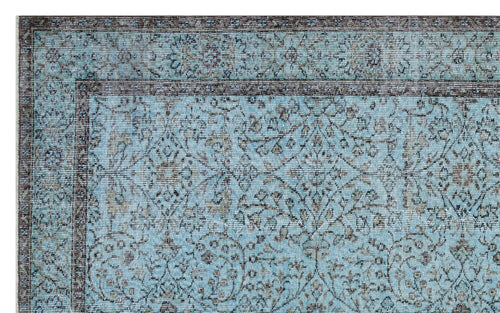 Load image 1 in gallery view. Light blue traditional rug with a dark brown floral medallion pattern and a detailed border.