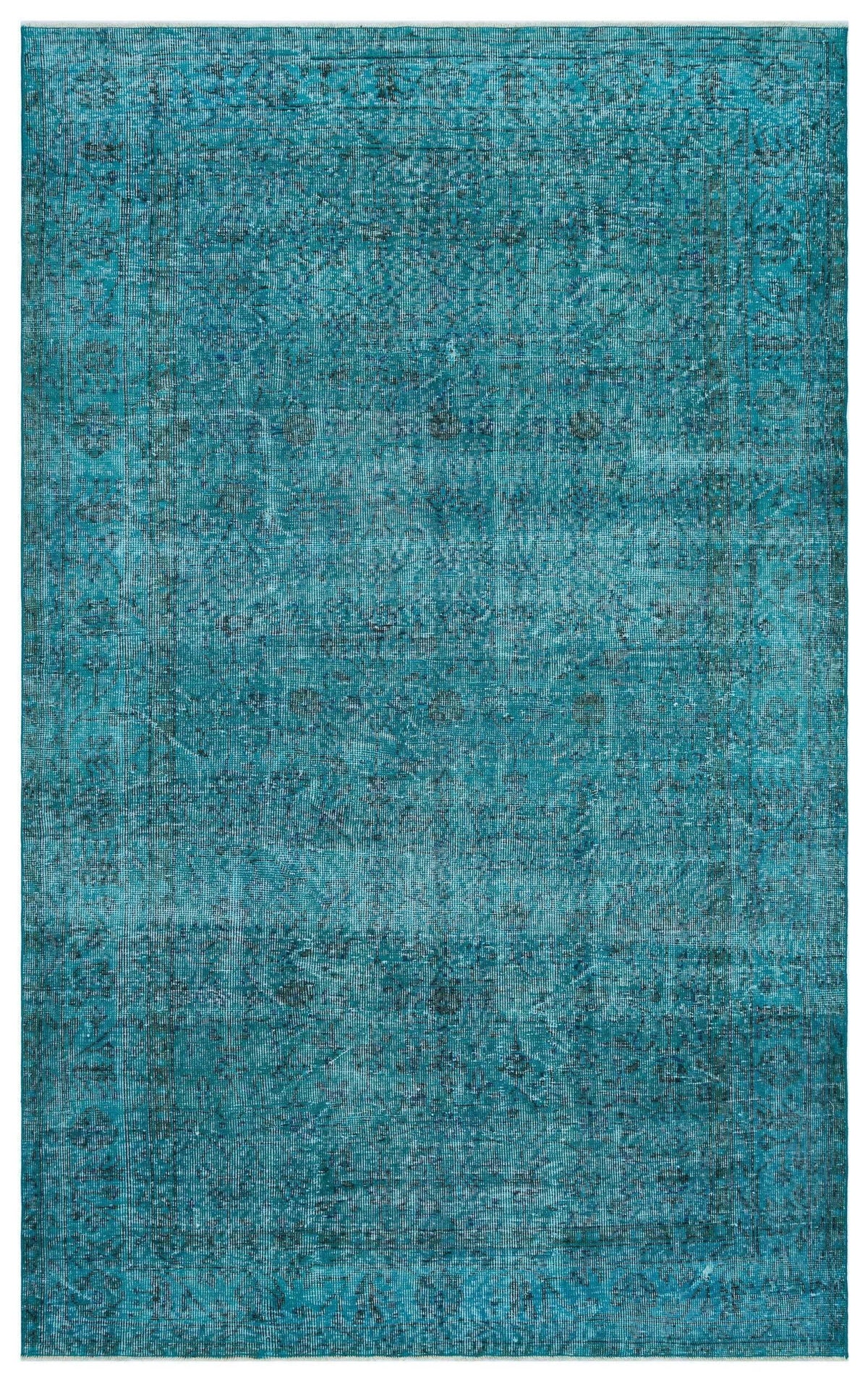 Teal distressed area rug with a faded traditional medallion pattern and a bordered edge.